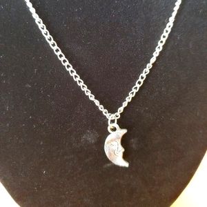 Smiling half moon necklace